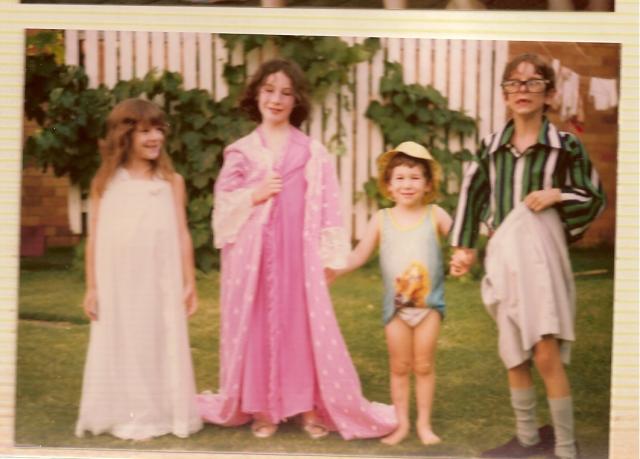 Dressing up. The 4 cousins.