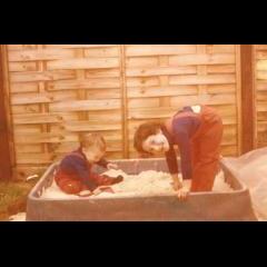 Playing in sandpit with Debbie